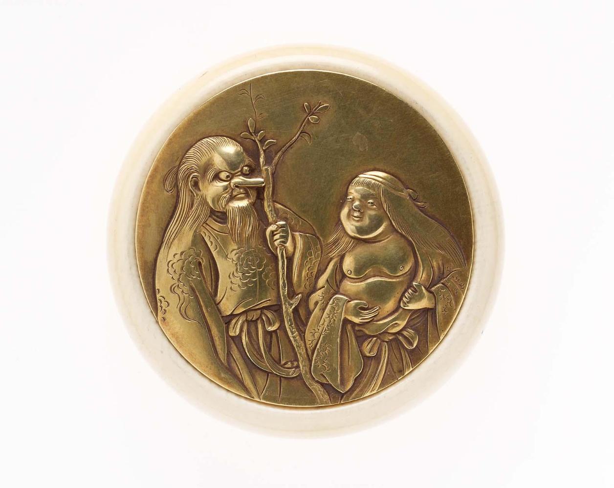 Kagami netsuke with design of Okame and a long-nosed tengu