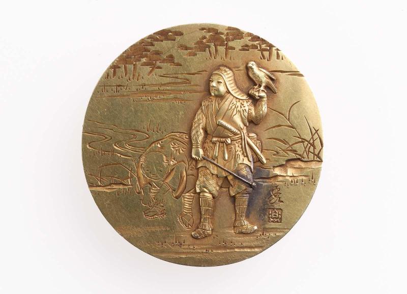 Kagami netsuke with design of a falconer and assistant