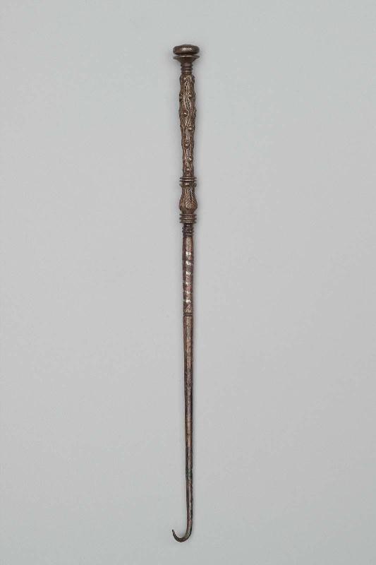 Retractor (one of an eleven-piece set of medical instruments)