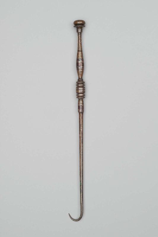 Retractor (one of an eleven-piece set of medical instruments)