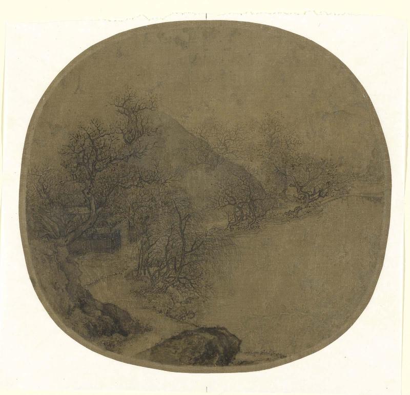 Cottage among trees by a lakeside