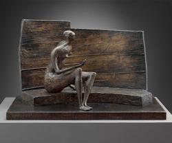 Seated figure against curved wall