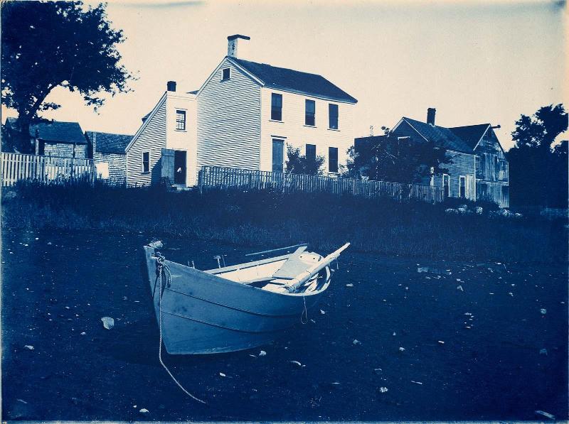 White Clapboard House and Dory