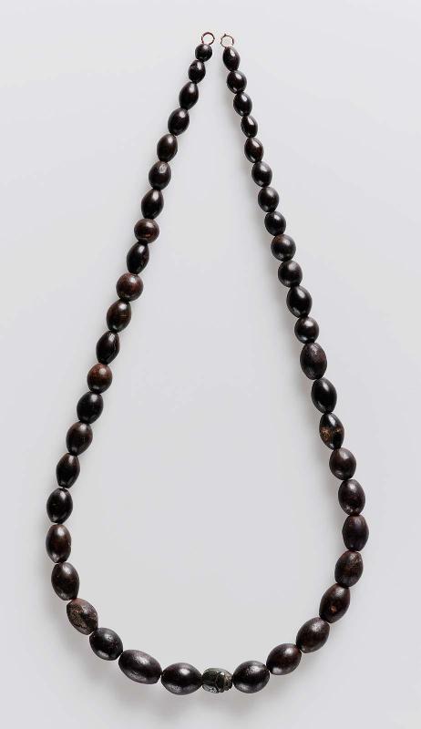 String of barrel beads and scarab